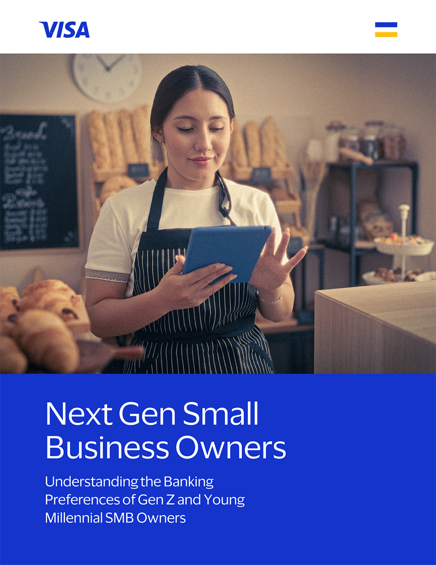 Woman using tablet in bakery with Visa banner
