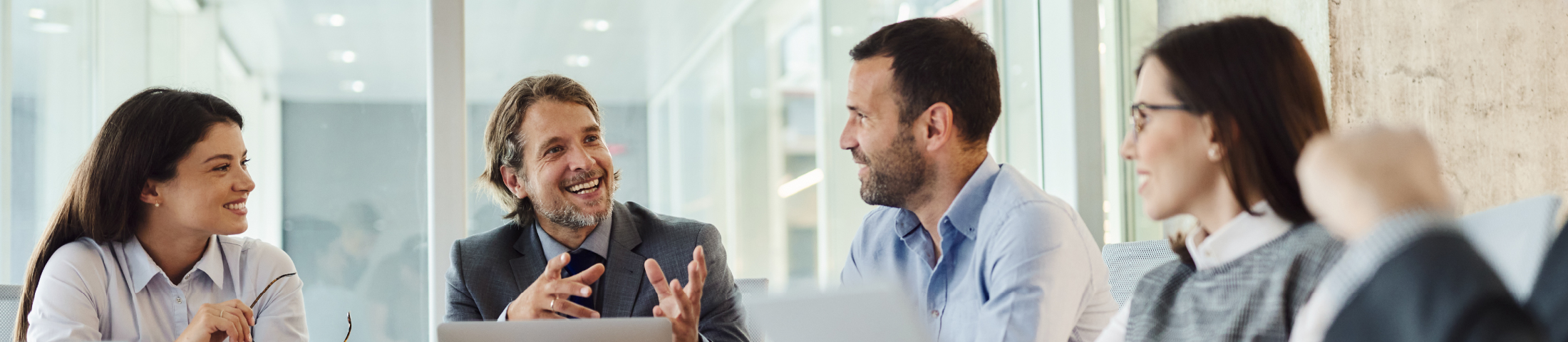 Business team smiling in office meeting