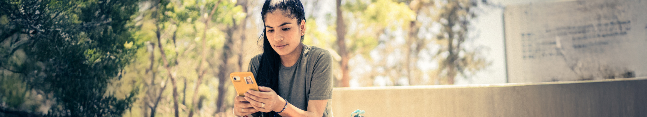 Woman using phone in park