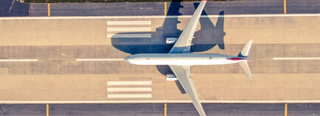 Aerial view of an airplane on a runway.