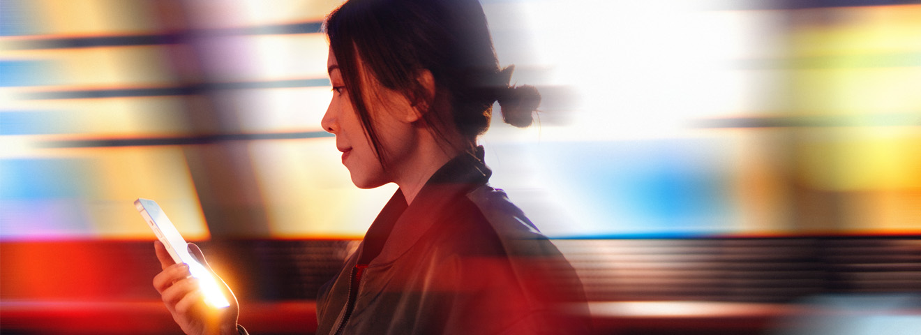 Woman using phone with motion blur