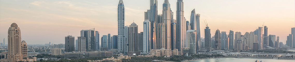 Dubai Marina skyline and beach at sunset