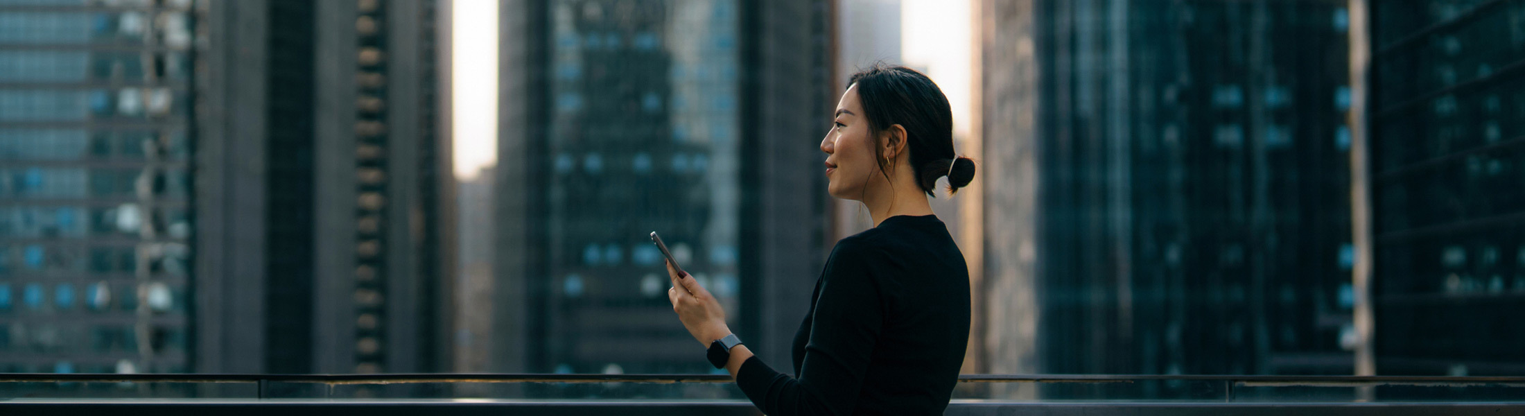 woman using smartphone city